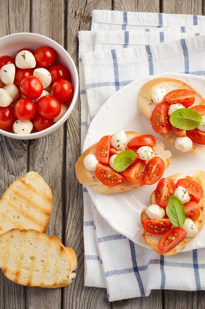 Bruschetta with cherry tomatoes and mozzarella.