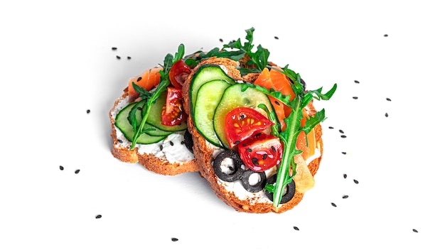 Bruschetta with cream cheese, salmon and vegetables isolated. Toast isolated. Sandwich isolated. Sandwich with salmon and cheese
