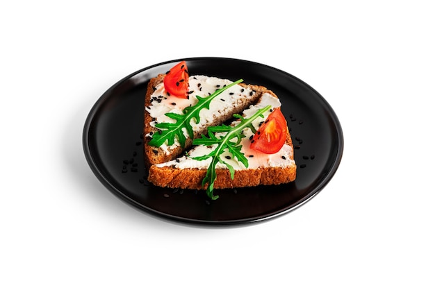 Bruschetta with cream cheese and vegetables isolated on a white background Toasts and coffee isolated Sandwich isolated Sandwich with vegetables and cheese High quality photo