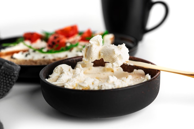 Bruschetta with cream cheese and vegetables isolated on a white background Toasts and coffee isolated Sandwich isolated Sandwich with vegetables and cheese High quality photo