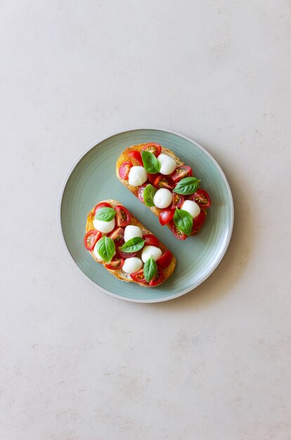 Bruschetta with mozzarella tomatoes and basil Vegetarian food Healthy eating