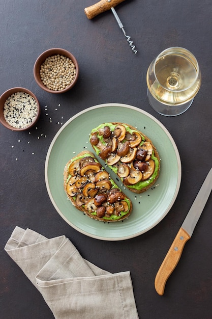 Bruschetta with mushrooms and avocados. Healthy eating. Vegetarian food. Keto diet.