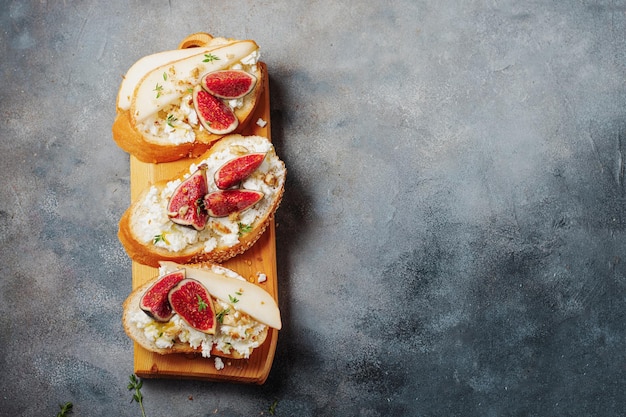 Bruschetta with pears cottage cheese figs thyme nuts and honey wine snacks