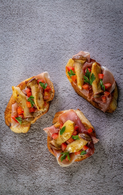 Bruschetta with prosciutto ham and tomatoes