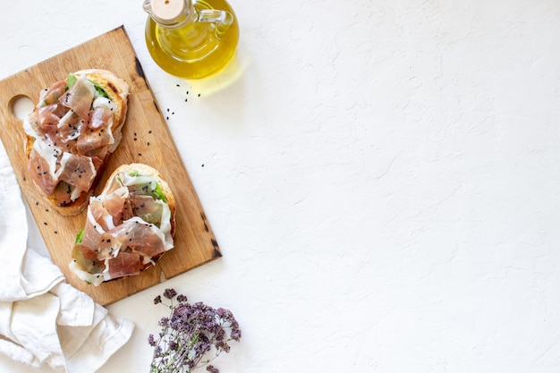 Bruschetta with prosciutto and serrano ham 