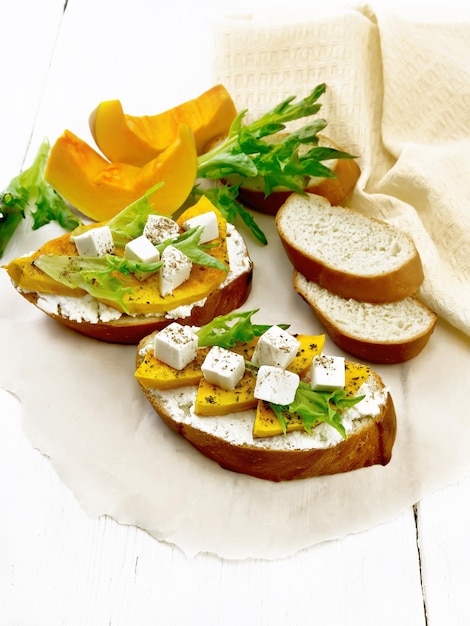 Bruschetta with pumpkin and ricotta on board