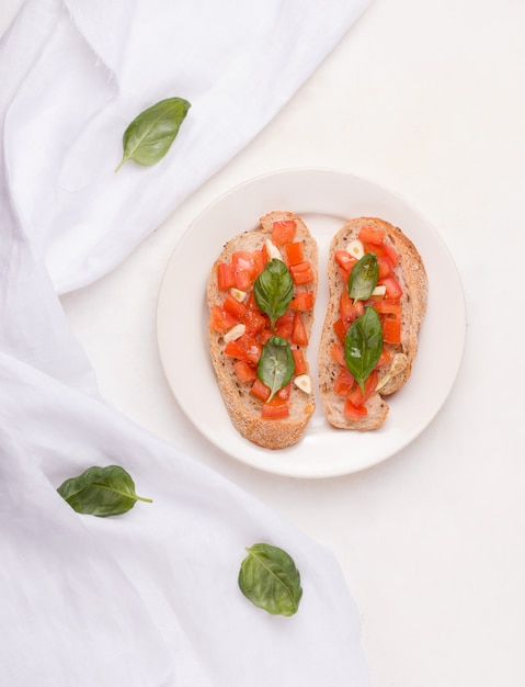 Bruschetta with tomatoes, basil, and garlic