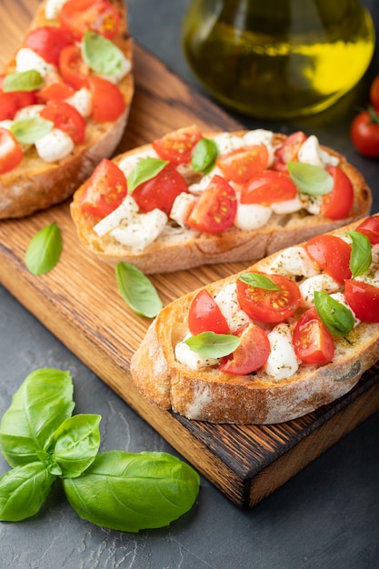 Bruschetta with tomatoes, mozzarella cheese.