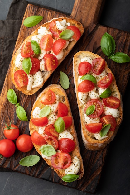 Bruschetta with tomatoes, mozzarella cheese.