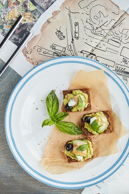 Bruschetta on a wooden table in a white plate