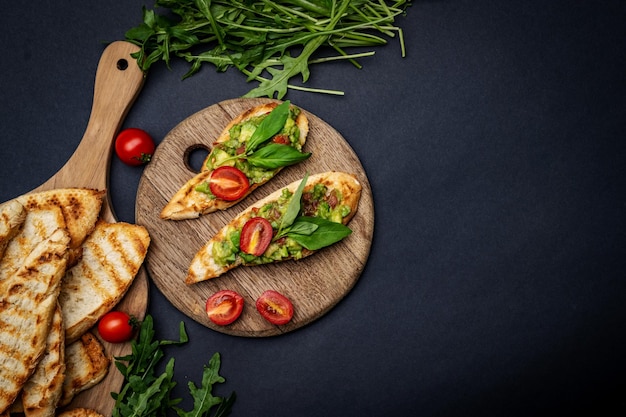 Bruschettas with guacamole and cherry tomatoes