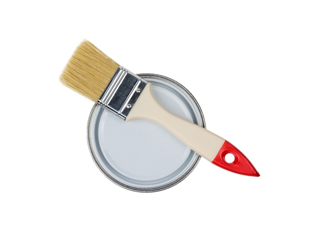 Photo brush on a closed jar isolated on a white background. materials for painting.