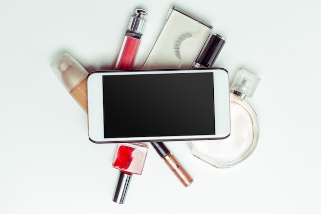 Brush and cosmetic isolated on a white background. Top view.