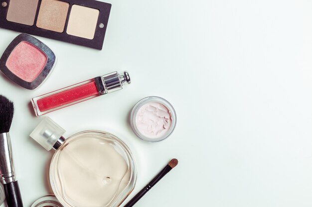 Brush and cosmetic isolated on a white background. Top view.