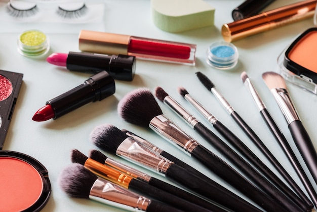 Brush and cosmetic isolated on a white background.