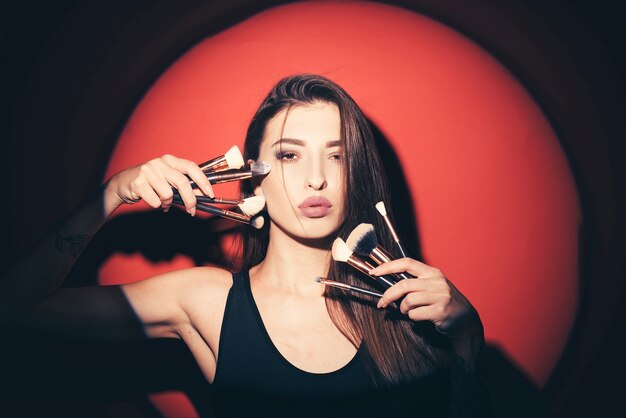 Brush and make up tools in girl's hands