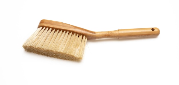 Brush with wooden handle isolated on white background Domestic broom for sweep and clean