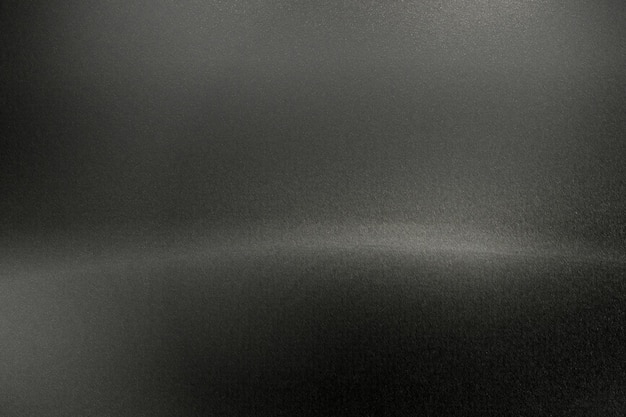 Brushed black metal wall with scratched surface abstract texture background