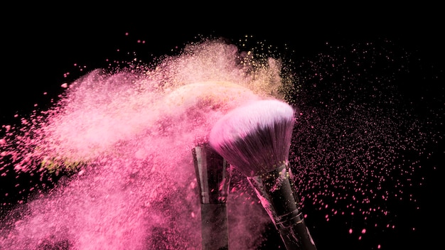 Photo brushes dusting off colorful powder