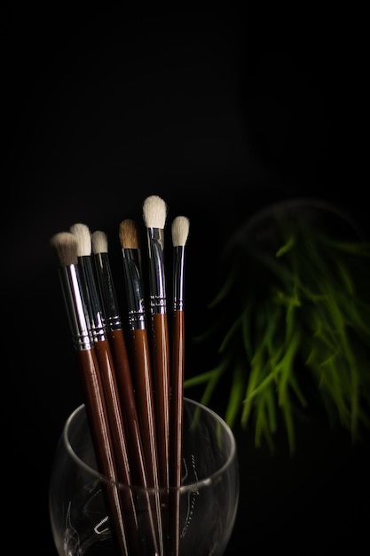 Brushes in glass with glass