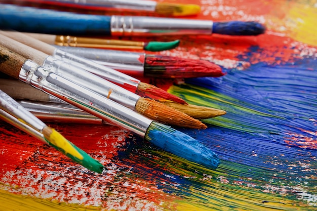 Brushes and paints for drawing in composition on the table