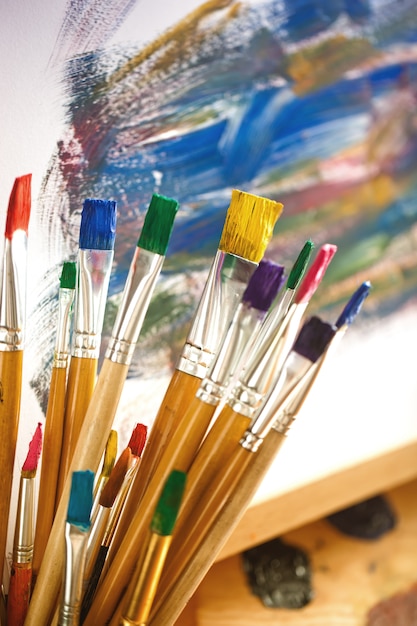 Brushes and paints for drawing in composition on the table