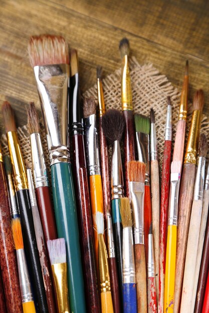 Brushes on wooden background