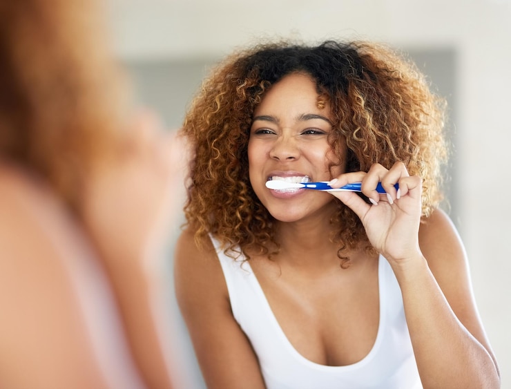 Photo brushing is the first and last thing i do shot of a young woman brushing her teeth in her bathroom