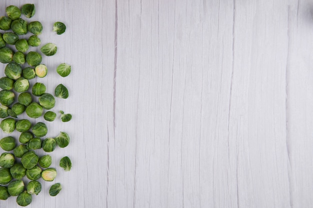 Brussel sprout over rustic wooden texture. Top view.