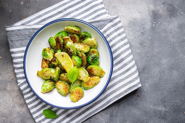 Brussels sprouts fried vegetable healthy meal food snack diet on the table copy space food