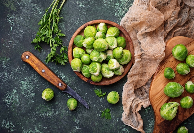 Brussels sprouts on green concrete background