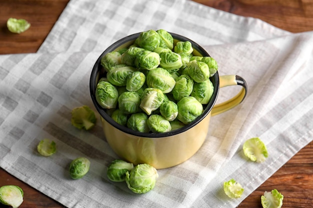 Brussels sprouts in mug on napkin