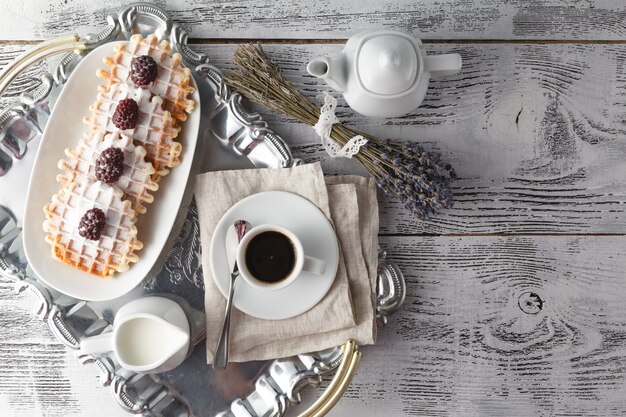 Brussels waffles with berries and coffee