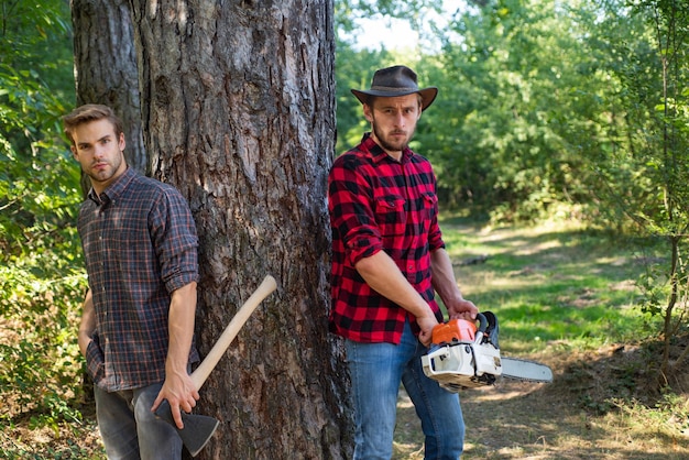 Brutal lumberjacks Cutting wood Brutality and masculinity Lumberjack style Man woodcutter with axe Man with axe