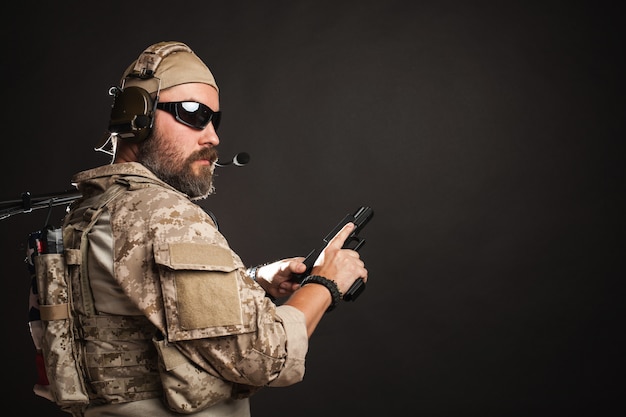 Brutal man in the military desert uniform.