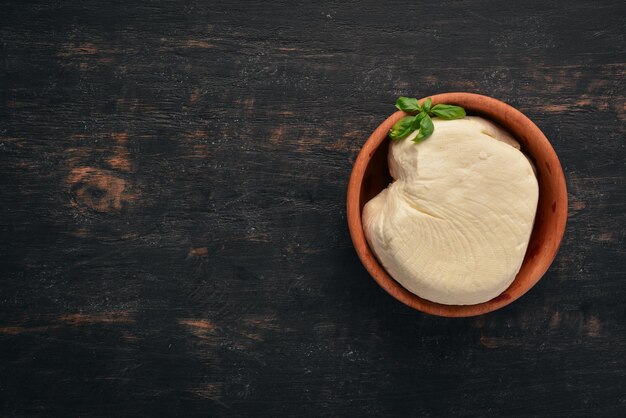 Brynza Cheese from sheep's milk Top view On a wooden background Free copy space