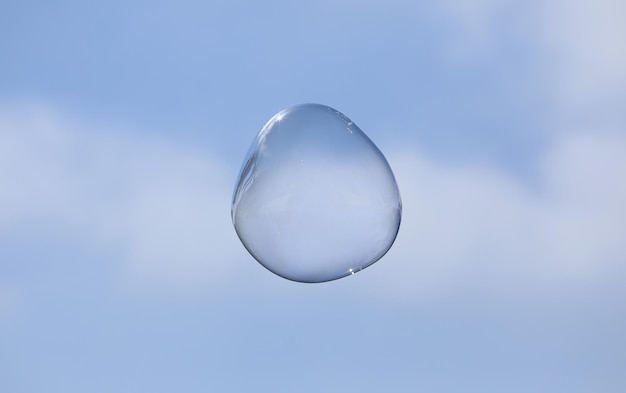 bubble blower on blue sky background