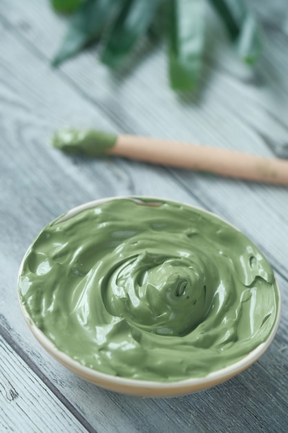 Bubble clay mask in container on white background