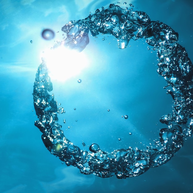 Bubble ring Underwater ascends towards the sun.