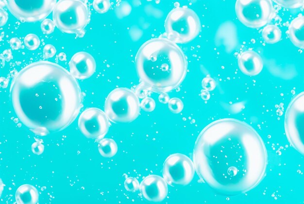 Bubbles in a blue container with bubbles in the water