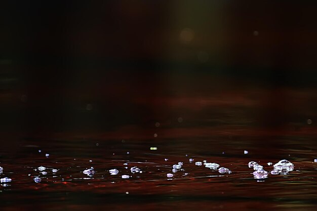 bubbles on the surface of the water stream / clear natural water, fast current, small river abstract background