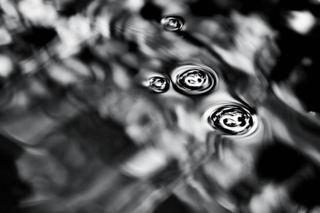 Bubbles on the water - heavy grain and noise - monochrome