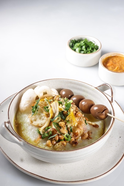 Bubur Ayam or Indonesian Rice Porridge with Shredded Chicken and Cakwe.