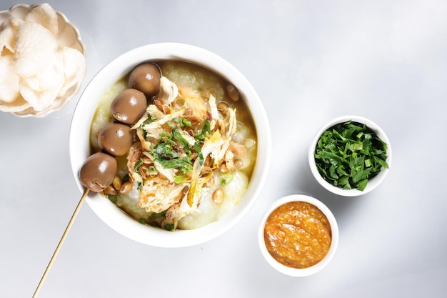 Bubur Ayam or Indonesian Rice Porridge with Shredded Chicken and Cakwe.