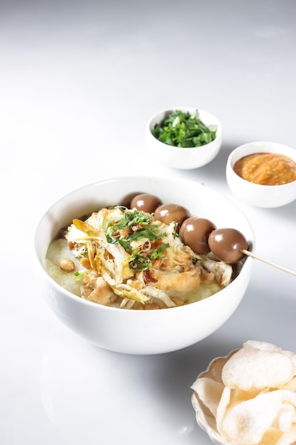 Bubur Ayam or Indonesian Rice Porridge with Shredded Chicken and Cakwe.