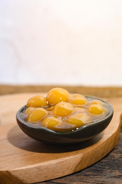 Bubur candil or bubur biji salak served on small ceramic bowl Ramadhan iftar food