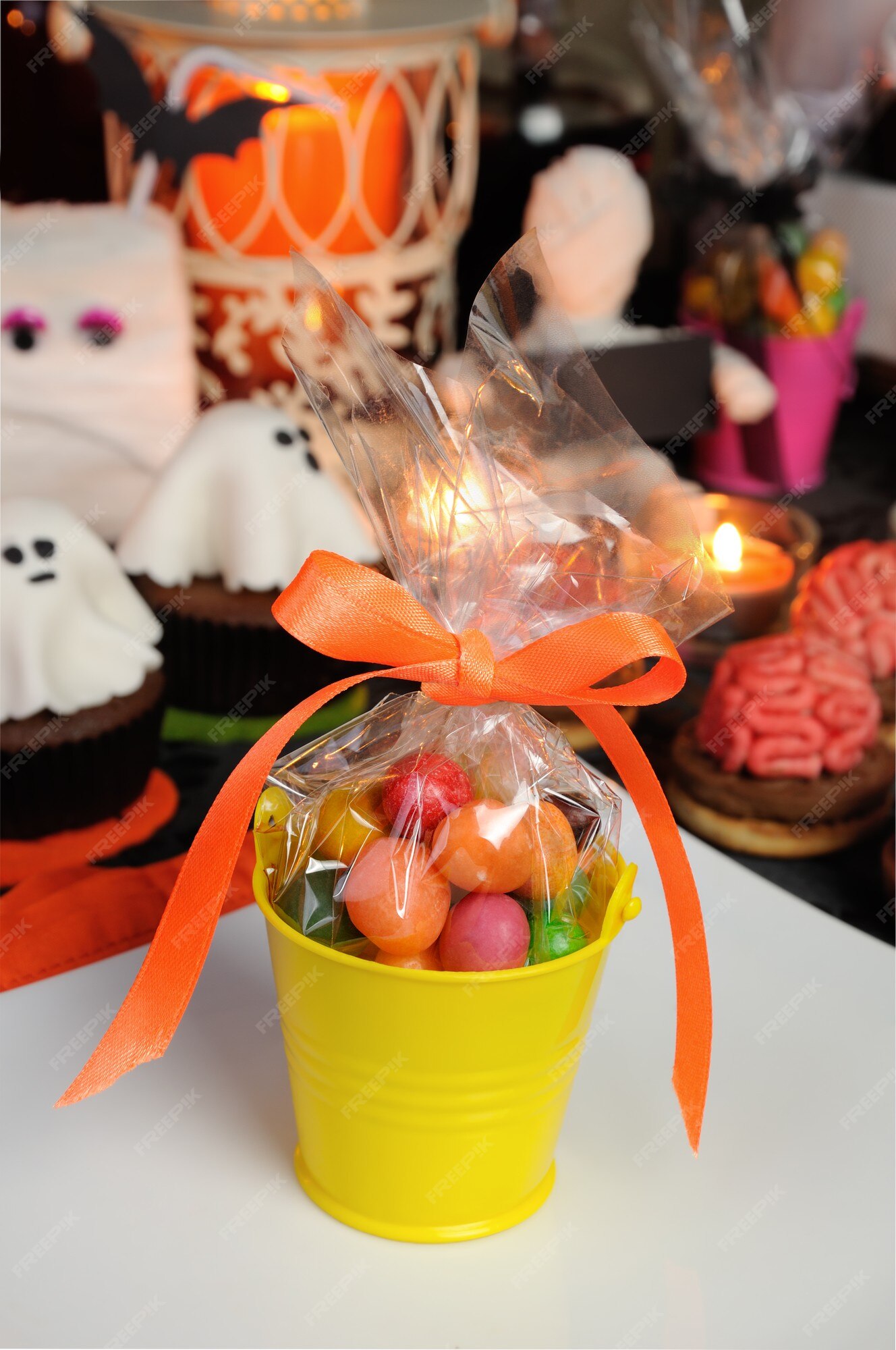 Premium Photo | Bucket Filled With Candy Table Among Sweets For Halloween