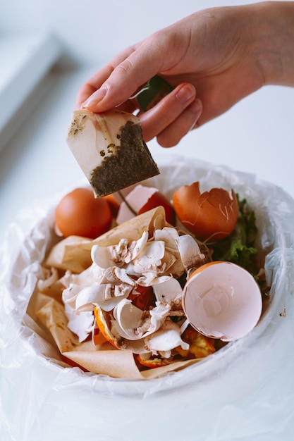 Bucket with food waste in kitchen