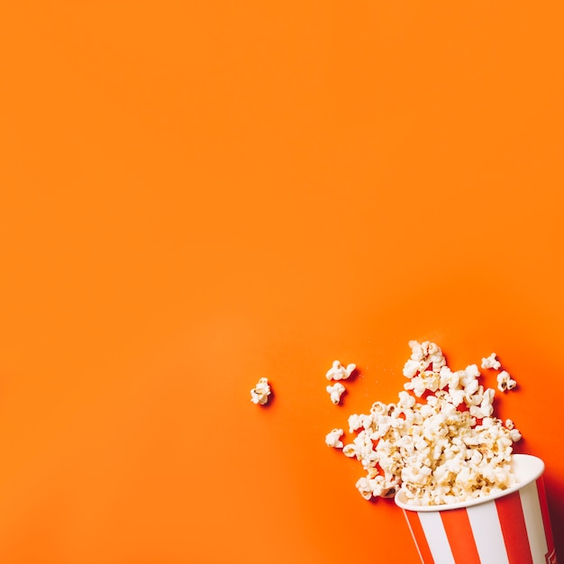 Bucket with spilled popcorn