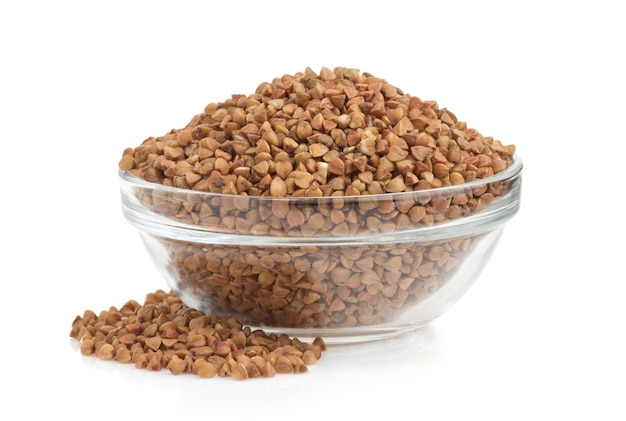 Buckwheat in bowl isolated on white surface